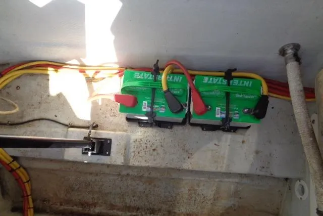 Slide: The Image of Dual Interstate batteries installed in a 2006 Cobalt 282 boat, with connected cables. - 39