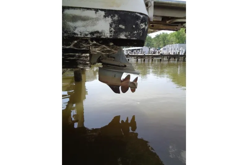 Slide: The Image of Propeller of a 2006 Cobalt 282 boat partially submerged in water at a dock. - 40