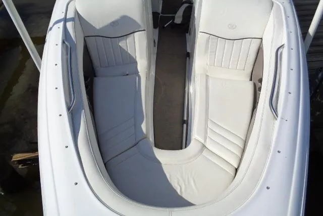 Slide: The Image of 2006 Cobalt 282 boat interior with white seating and sleek design. - 5