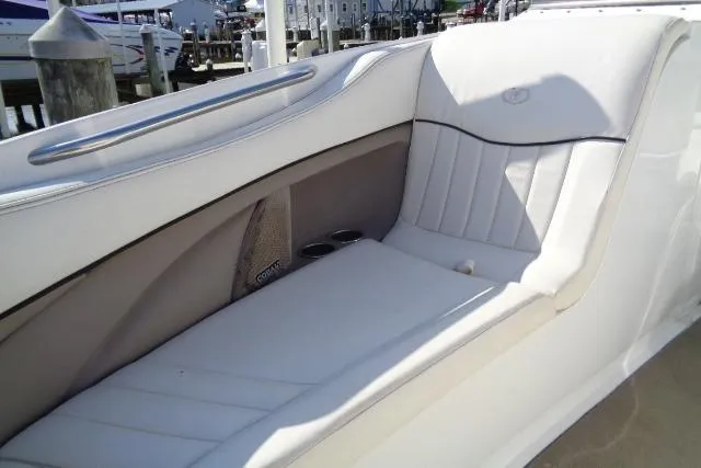 Slide: The Image of 2006 Cobalt 282 boat interior with white leather seating and cup holders. - 7