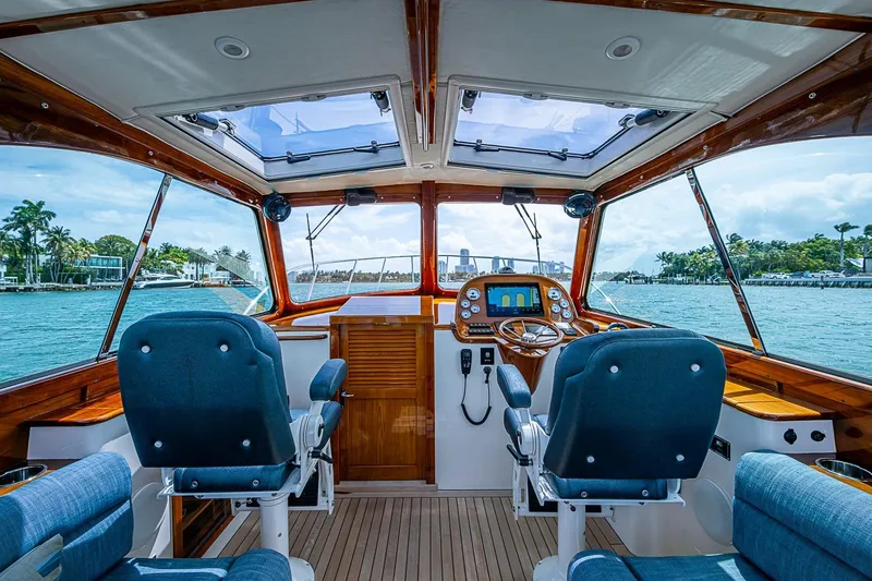 Slide: The Image of Interior view of 2011 Hinckley Picnic Boat 37 MKIII helm with ocean backdrop. - 14