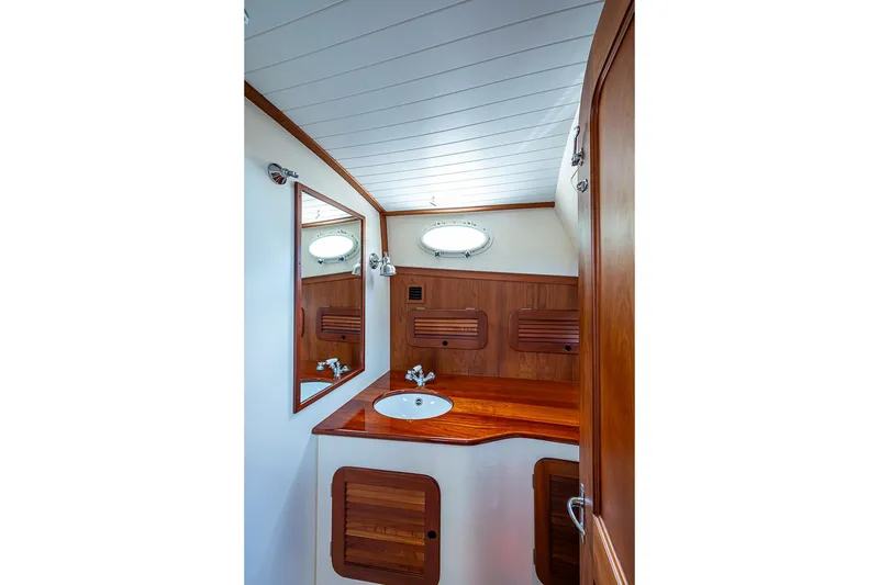 Slide: The Image of Elegant wooden interior of 2011 Hinckley Picnic Boat 37 MKIII bathroom. - 18