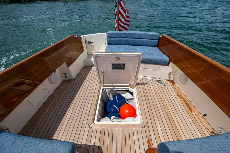 Slide: The Image of Hinckley Picnic Boat 37 MKIII, 2011, open deck with storage compartment and American flag. - 22