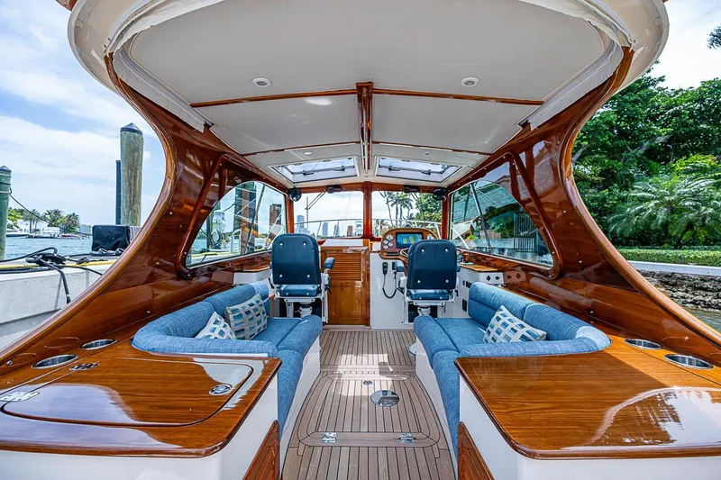 Slide: The Image of Luxurious 2011 Hinckley Picnic Boat 37 MKIII interior with elegant wood finish and plush seating. - 7