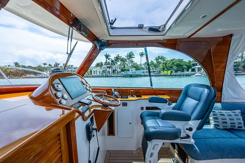 Slide: The Image of Interior view of 2011 Hinckley Picnic Boat 37 MKIII helm with luxurious seating and controls. - 8