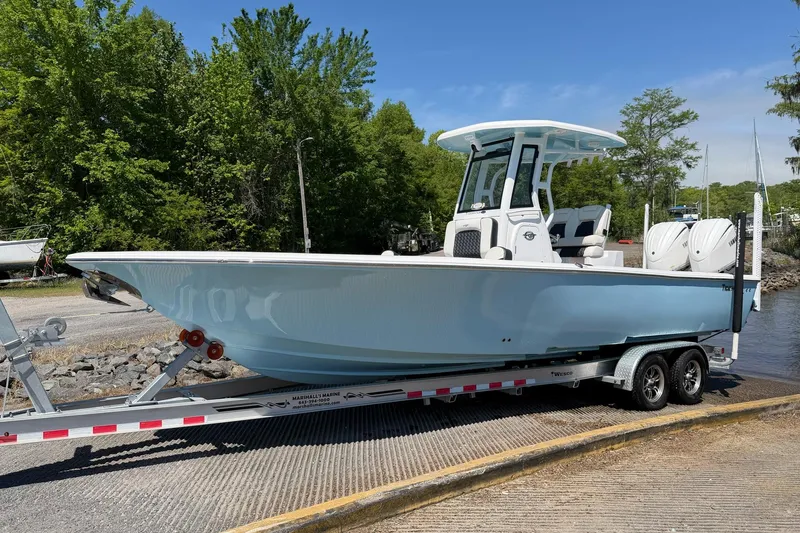 Slide: The Image of 2024 Tidewater 2700 Carolina Bay boat on trailer, ready for launch. - 18