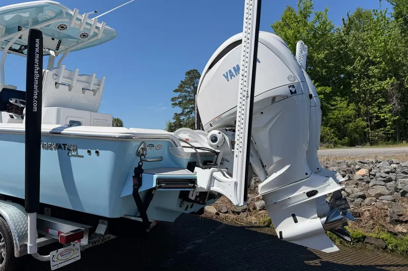 Slide: The Image of 2024 Tidewater 2700 Carolina Bay boat with Yamaha outboard motor on trailer. - 21
