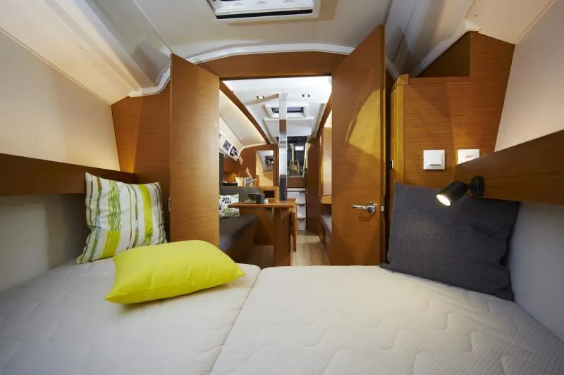 Slide: The Image of Manufacturer Provided Image: Interior cabin of 2019 Jeanneau Sun Odyssey 349 sailboat with cozy bedding. - 4
