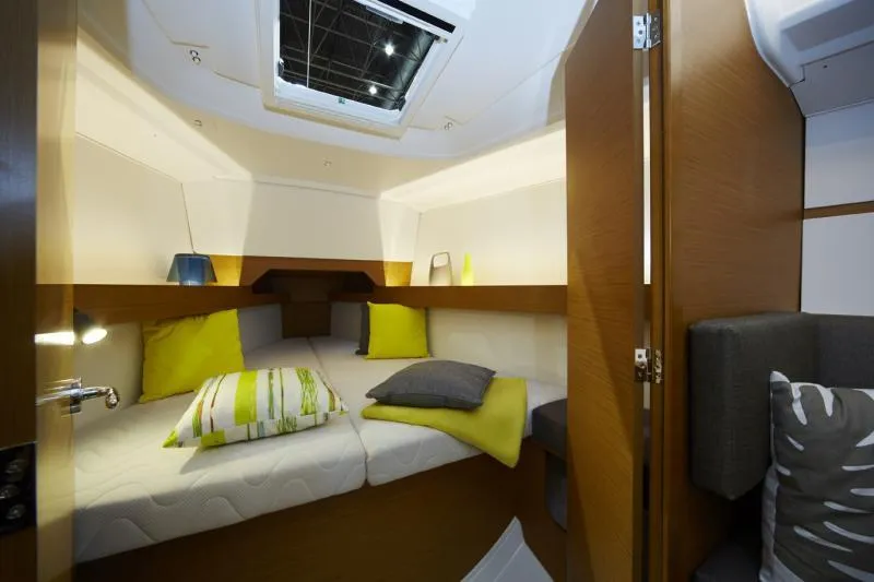 Slide: The Image of Manufacturer Provided Image: 2019 Jeanneau Sun Odyssey 349 cabin interior with cozy bedding and modern design. - 5