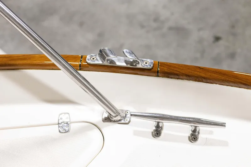 Slide: The Image of Elegant 2007 Legacy 32 Express yacht interior with striped seating and wooden table. - 16