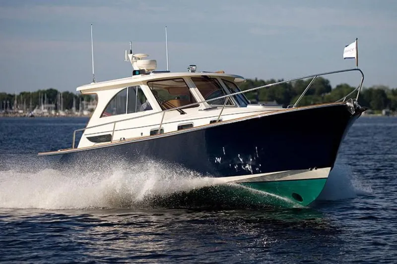 Slide: The Image of Raymarine S100 remote control on marble surface, featuring standby and pilot buttons. - 20