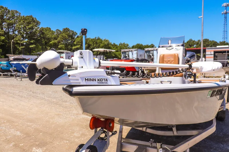 Slide: The Image of 2024 Avid 21 FSX boat with Minn Kota Terrova motor in outdoor setting. - 8