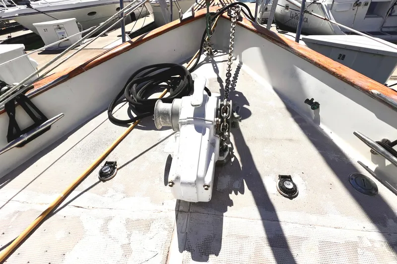 Slide: The Image of Deck of 1983 Westsail 42 Center Cockpit with anchor chain and winch. - 15