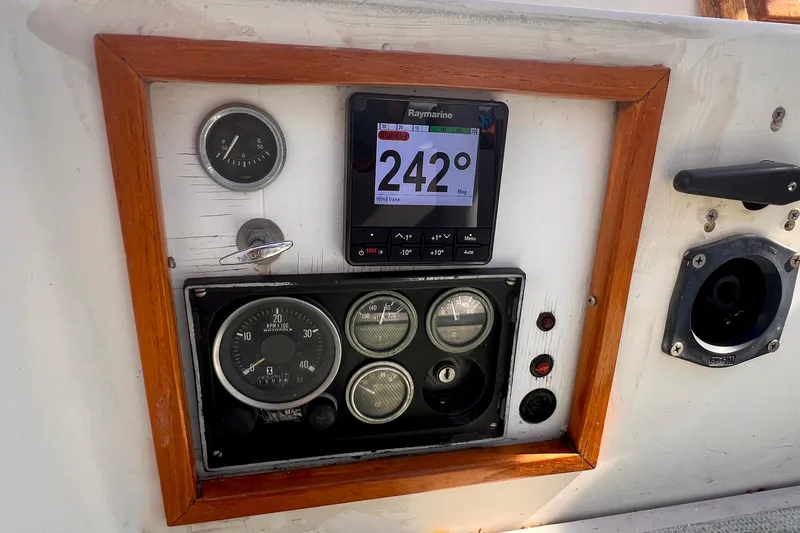 Slide: The Image of Instrument panel of a 1983 Westsail 42 Center Cockpit sailboat with navigation gauges. - 21
