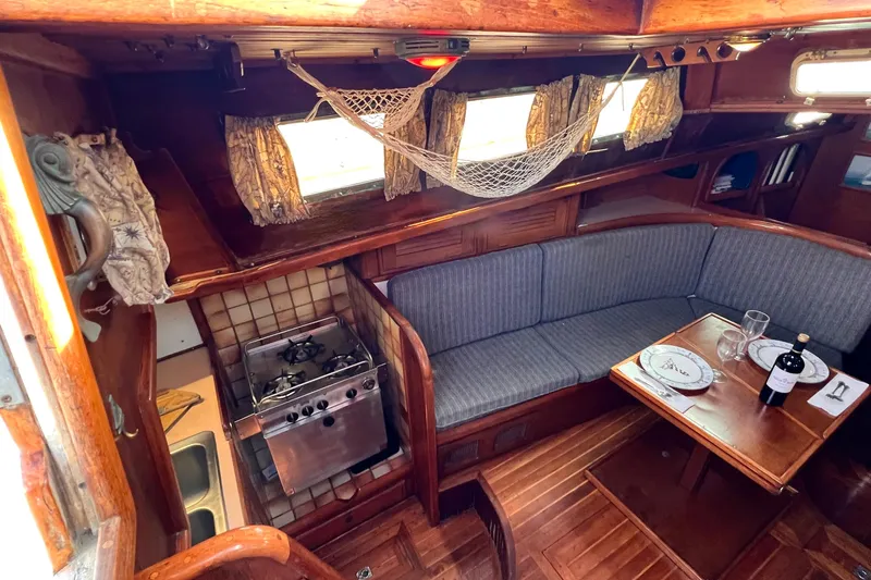 Slide: The Image of Interior of 1983 Westsail 42 Center Cockpit with dining area and kitchen. - 24