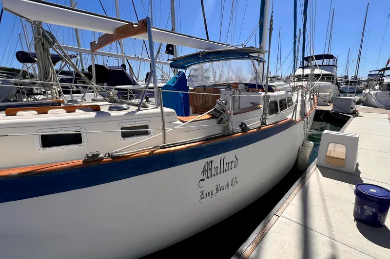 Slide: The Image of 1983 Westsail 42 Center Cockpit sailboat docked at marina, sunny day. - 5