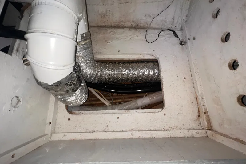 Slide: The Image of Interior view of 1983 Westsail 42 Center Cockpit showing ventilation ducts and wiring. - 52