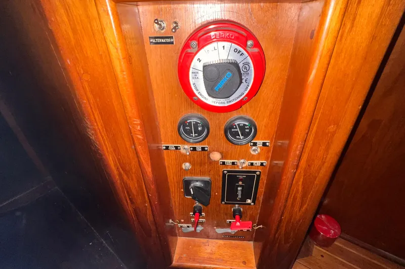 Slide: The Image of Control panel of a 1983 Westsail 42 Center Cockpit sailboat with gauges and switches. - 59