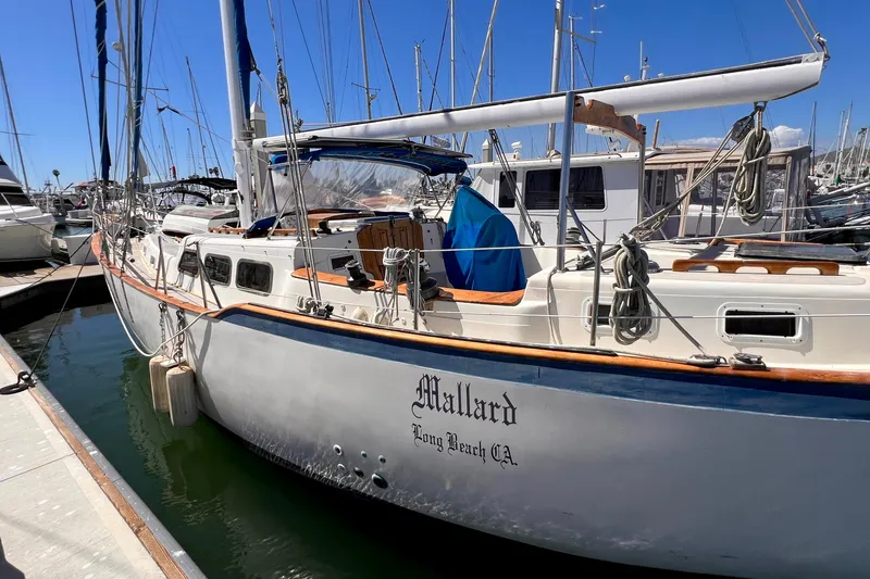 Slide: The Image of 1983 Westsail 42 Center Cockpit sailboat docked in marina, sunny day. - 9