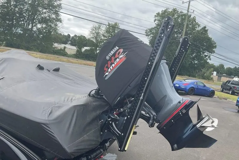 Slide: The Image of 2017 Skeeter FX21 LE boat with Yamaha engine cover, parked outdoors. - 11