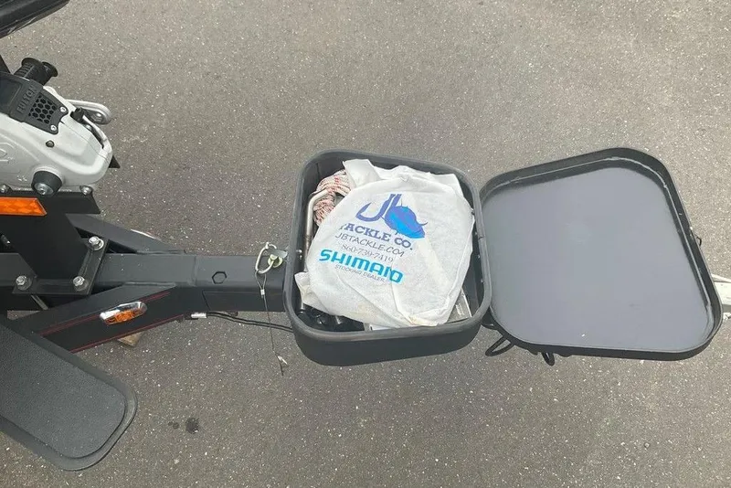 Slide: The Image of 2017 Skeeter FX21 LE boat storage compartment with fishing gear bag inside. - 18