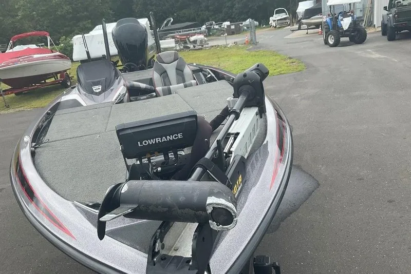 Slide: The Image of 2017 Skeeter FX21 LE bass boat with Lowrance electronics, parked outdoors. - 19