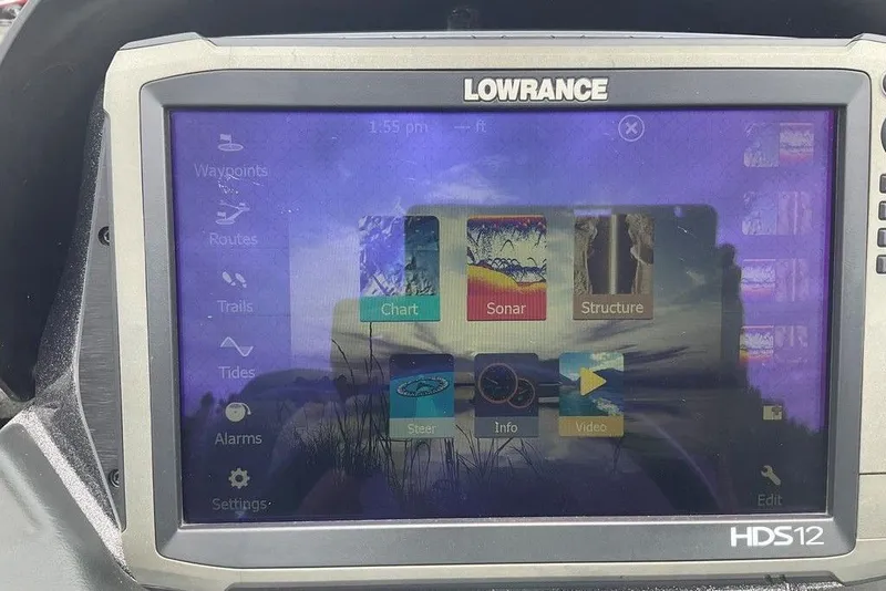 Slide: The Image of Lowrance HDS12 display on 2017 Skeeter FX21 LE boat, showing navigation and sonar options. - 30