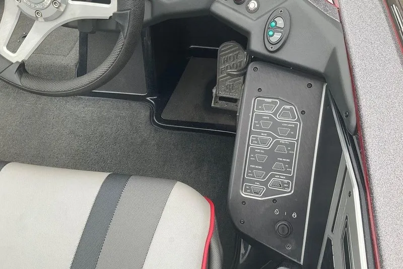 Slide: The Image of 2017 Skeeter FX21 LE boat cockpit with steering wheel and control panel. - 31