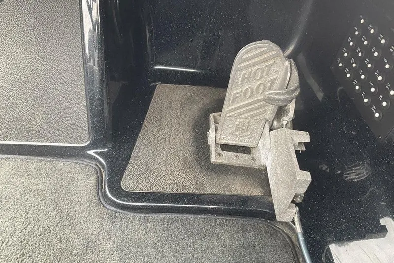Slide: The Image of 2017 Skeeter FX21 LE boat foot throttle pedal, labeled "Hot Foot," on textured flooring. - 36