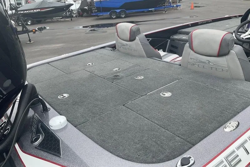 Slide: The Image of 2017 Skeeter FX21 LE boat interior with gray carpet and branded seats. - 39