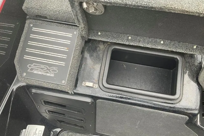 Slide: The Image of 2017 Skeeter FX21 LE boat interior with storage compartment and FX Series branding. - 45