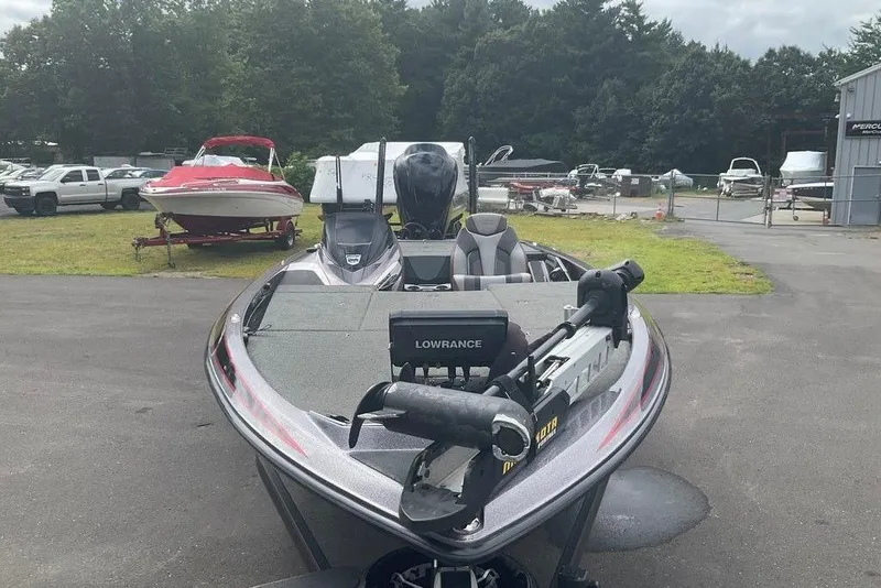 Slide: The Image of 2017 Skeeter FX21 LE bass boat with Lowrance electronics, parked outdoors. - 50
