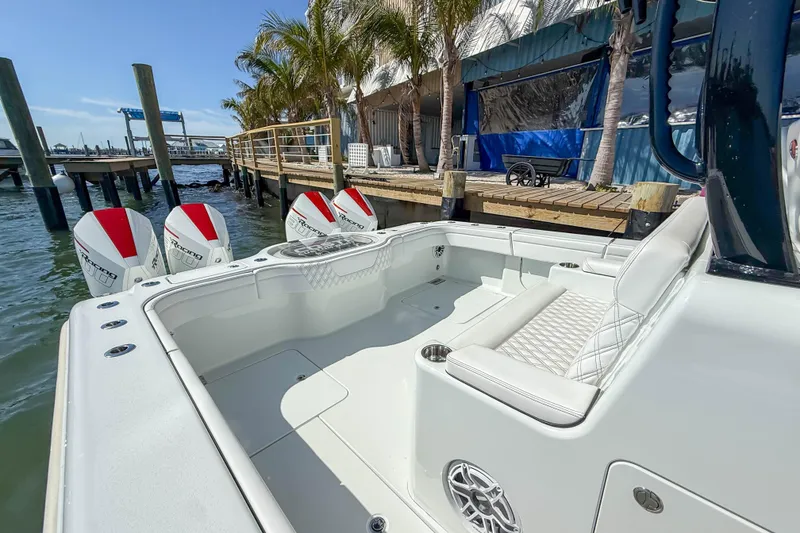 Slide: The Image of 2023 Costa Custom Boats 34 docked, showcasing sleek design and powerful engines. - 21