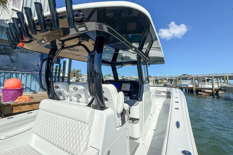 Slide: The Image of 2023 Costa Custom Boats 34 at dock, featuring sleek design and modern amenities. - 22