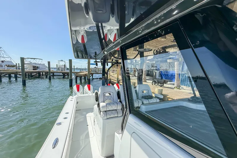 Slide: The Image of 2023 Costa Custom Boats 34 docked, showcasing sleek design and modern features. - 9