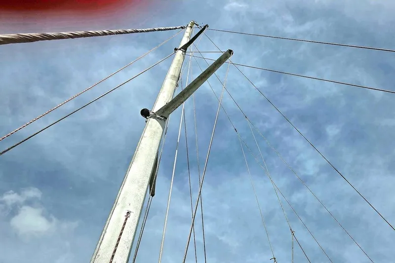 Slide: The Image of Mast and rigging of 1995 Catamaran St. Francis 43 against a cloudy sky. - 14
