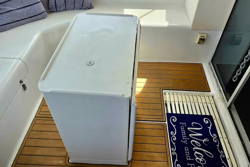 Slide: The Image of 1995 Catamaran St. Francis 43 interior with wooden flooring and a welcome mat. - 19