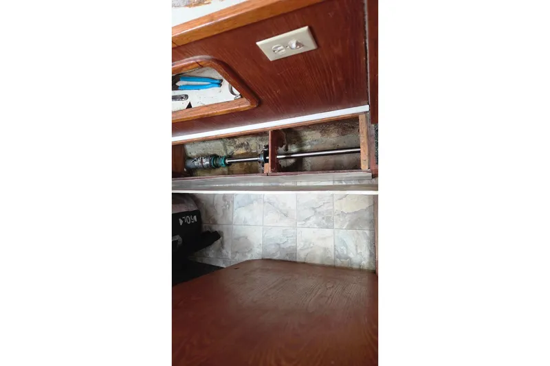 Slide: The Image of Interior view of 1995 Catamaran St. Francis 43 showing wooden cabinetry and mechanical components. - 30