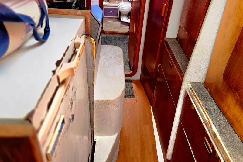Slide: The Image of Interior of 1995 Catamaran St. Francis 43 with wooden cabinetry and compact layout. - 31