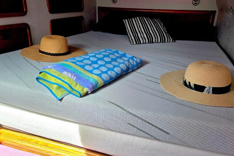 Slide: The Image of Cozy cabin interior of 1995 Catamaran St. Francis 43 with hats and towel. - 33