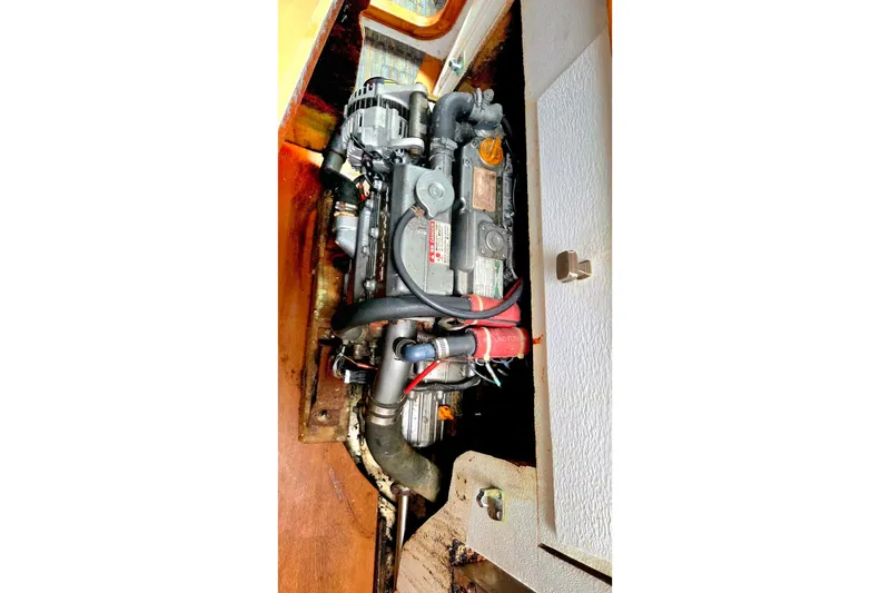 Slide: The Image of Engine compartment of a 1995 Catamaran St. Francis 43, showcasing mechanical components. - 38