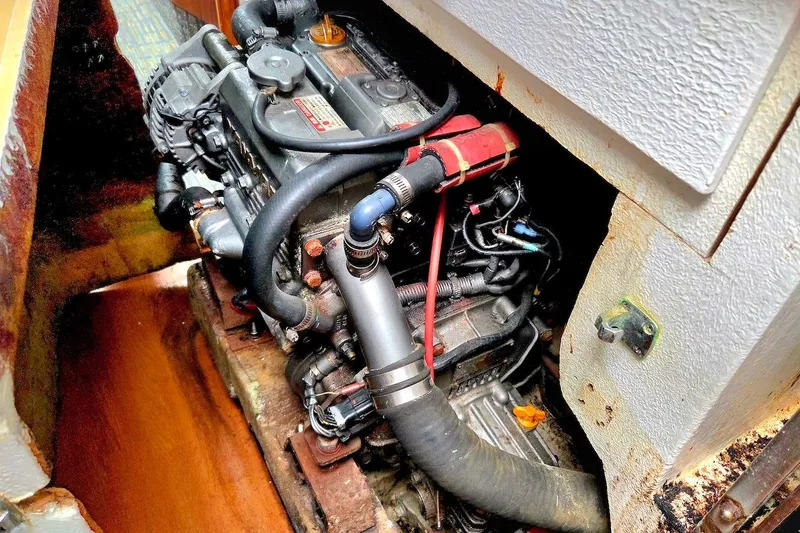 Slide: The Image of Engine compartment of a 1995 Catamaran St. Francis 43, showcasing mechanical components. - 39