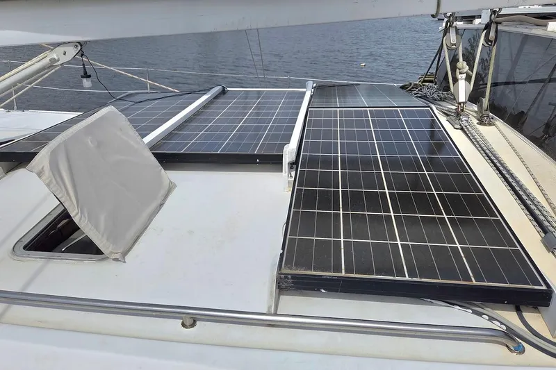 Slide: The Image of Solar panels on 1995 Catamaran St. Francis 43 deck, near water. - 8