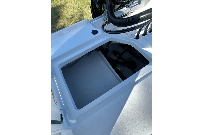 Slide: The Image of Open compartment of 2026 Action Craft 22 Bay boat, showcasing interior details. - 16