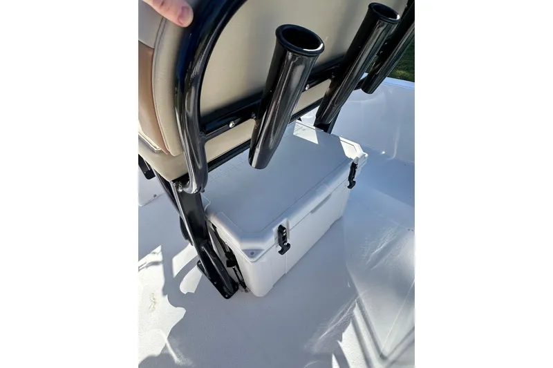 Slide: The Image of 2026 Action Craft 22 Bay boat interior with cooler and rod holders. - 19