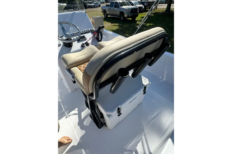 Slide: The Image of 2026 Action Craft 22 Bay boat interior with steering console and cushioned seating. - 20