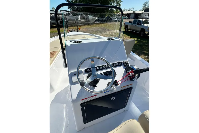 Slide: The Image of 2026 Action Craft 22 Bay boat console with steering wheel and controls. - 21
