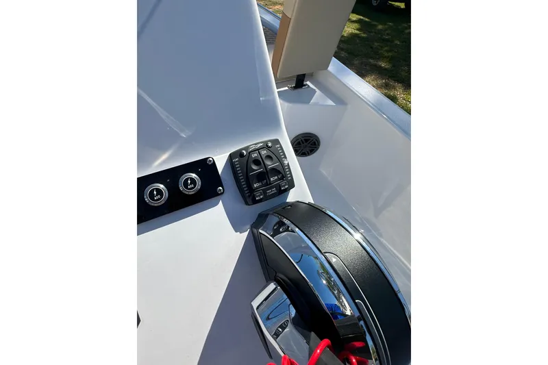Slide: The Image of Control panel of 2026 Action Craft 22 Bay boat with steering wheel. - 23