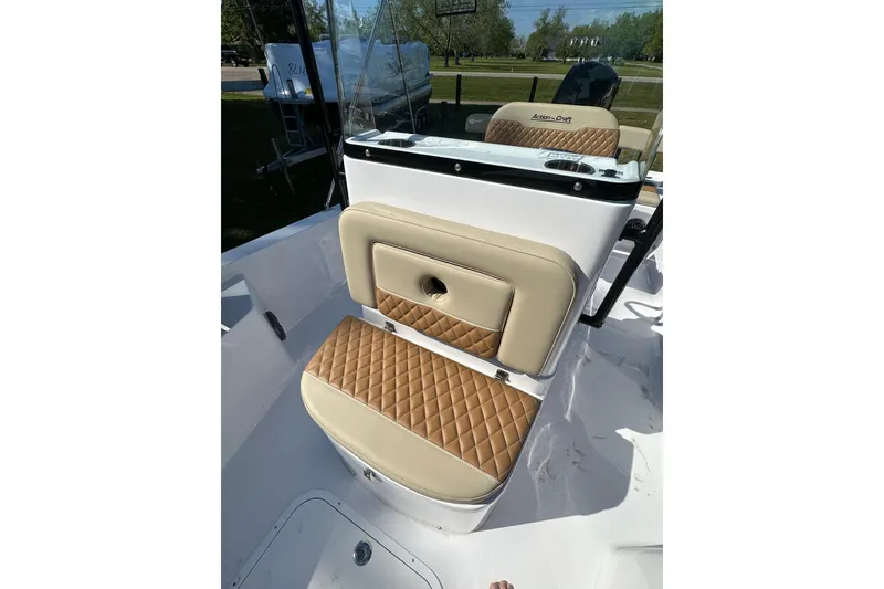 Slide: The Image of 2026 Action Craft 22 Bay boat with tan quilted seating and sleek console design. - 28