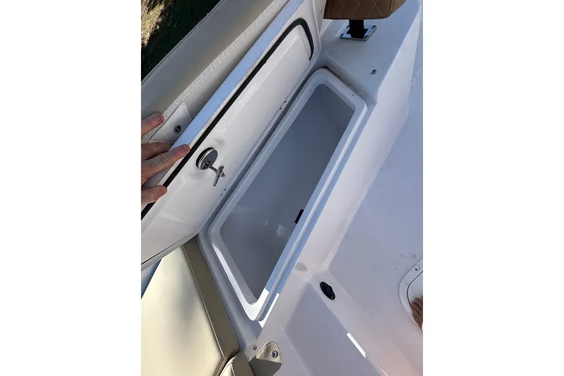 Slide: The Image of Open storage compartment on 2026 Action Craft 22 Bay boat. - 32